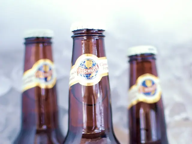 In the picture there are three wine bottles and beside to them there are ice cubes. In the...