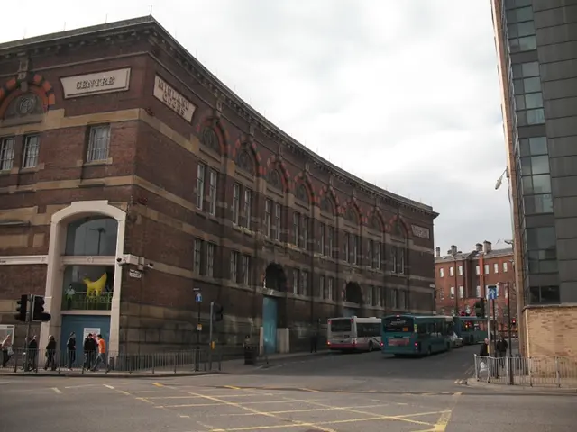 This image consists of buildings along with the windows. At the bottom, there is a road. On the...