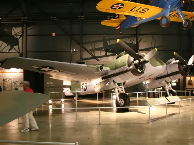 In the picture there is an inside view of the hangar, we can see there are planes, there is a plane...