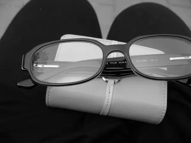 This is a black and white image. In this image, I can see a person's legs. On the legs goggles and...