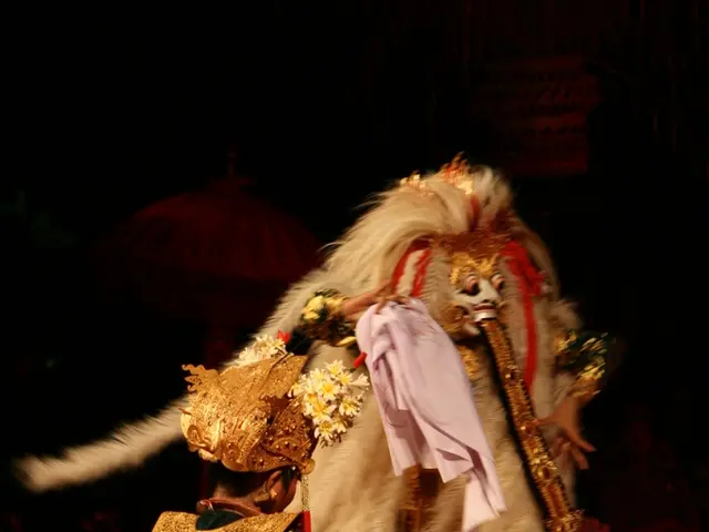 In this image, I can see two persons on the floor with fancy dresses. There is a dark background.