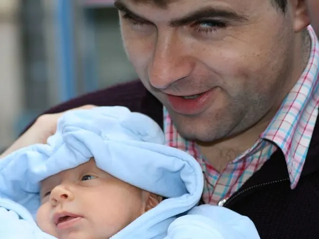 In the center of the image there is a person holding a baby.