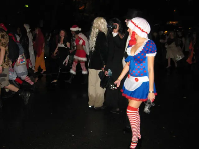 In this image there are a group of people walking on the floor, in which some are wearing drama...