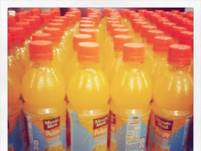 Here we can see few bottles are arranged on an order. It's caps are in orange color.