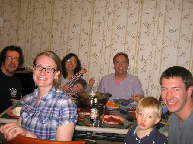 This is a picture taken in living room of a house. In the center of the picture there is a table,...