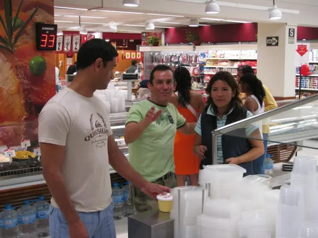 In this image there are a group of people standing in the shopping store where we can see there are...