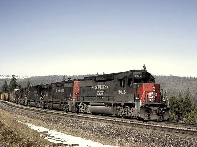 In the center of the image we can see a train on the track. In the background there are three,...