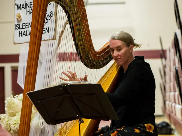 In this image there is a woman who is looking into the book which is in front of her and playing...