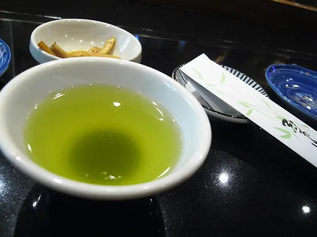 In this picture, it looks like a black tray and on the train there are plates, bowl and an object....