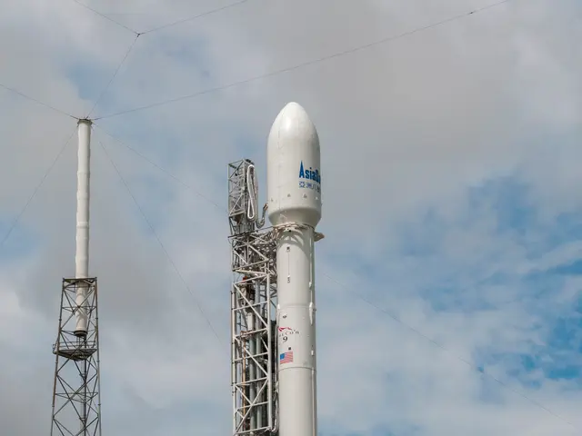 The image shows a SpaceX Falcon 9 rocket on the launch pad at NASA's Kennedy Space Center,...