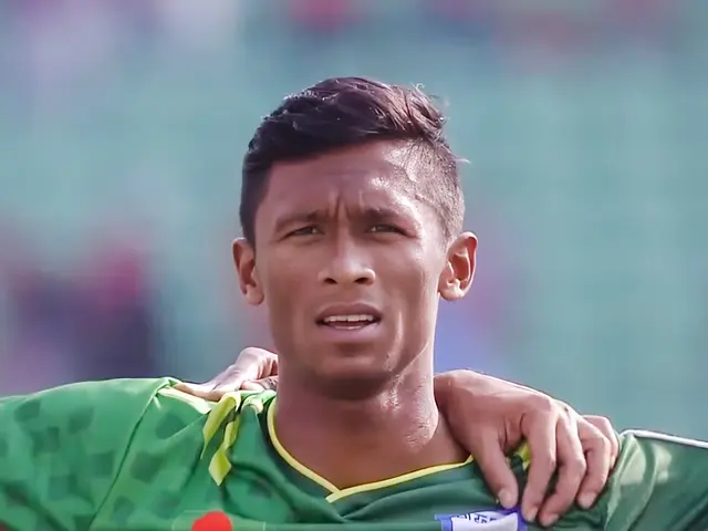 The image shows Bangladesh's Mohammad Shamzai wearing a green t-shirt, with a blurred background,...