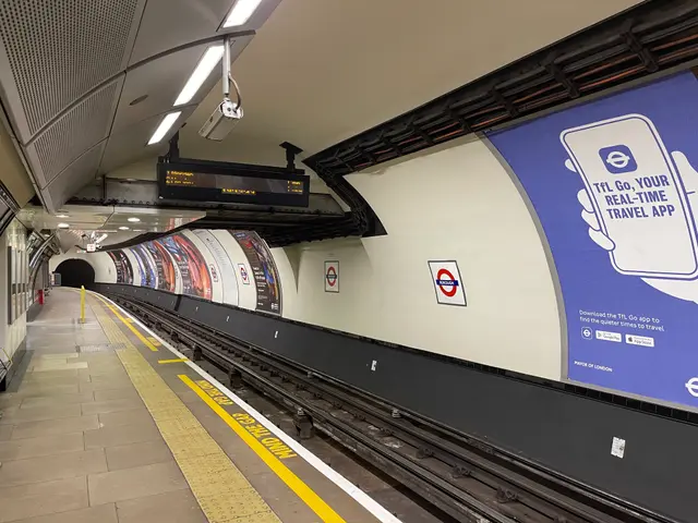 The image shows a subway station with a train on the tracks, a platform on the left side with a few...