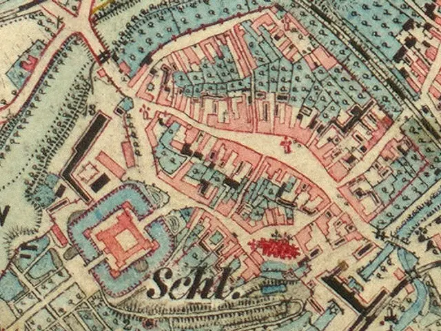 The image shows an old map of the city of Schleswig-Holstein, Germany, with text written on it. The...