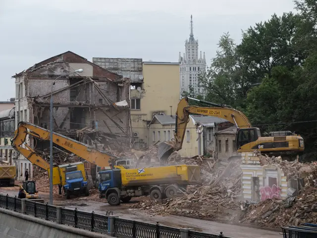 The image shows a bustling scene of a demolition of a building in the city of Kiev, Ukraine. We can...