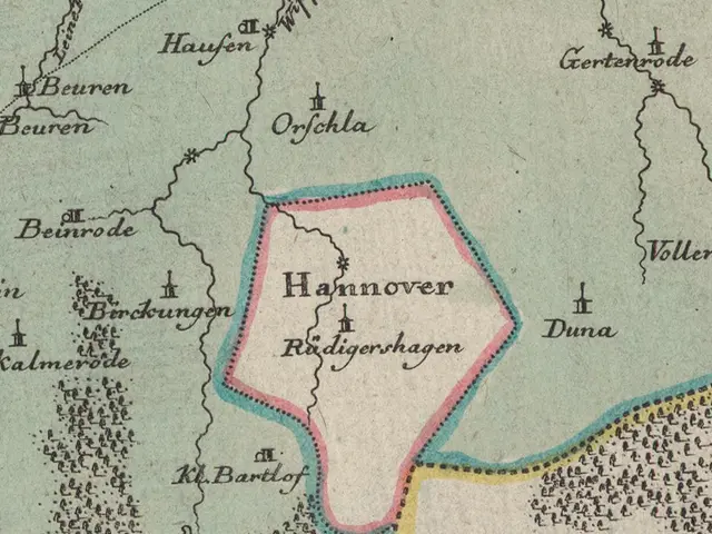 The image shows an old map of the city of Hannover, Germany, with text written on it. The map is...