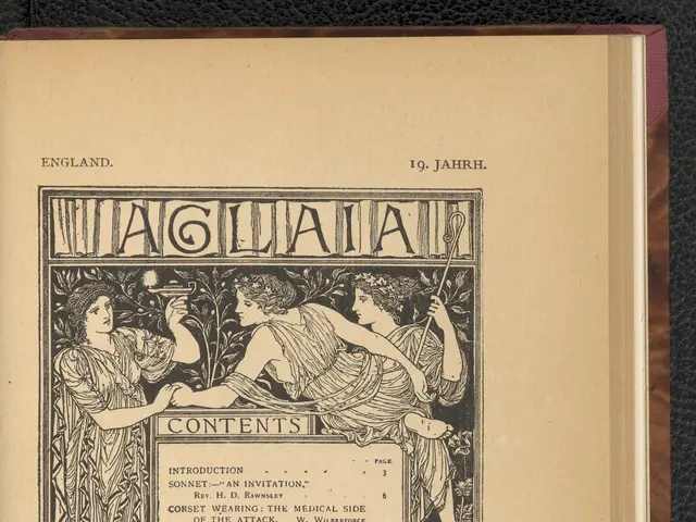 The image shows an open book on a black surface with text and pictures of people on the cover page....