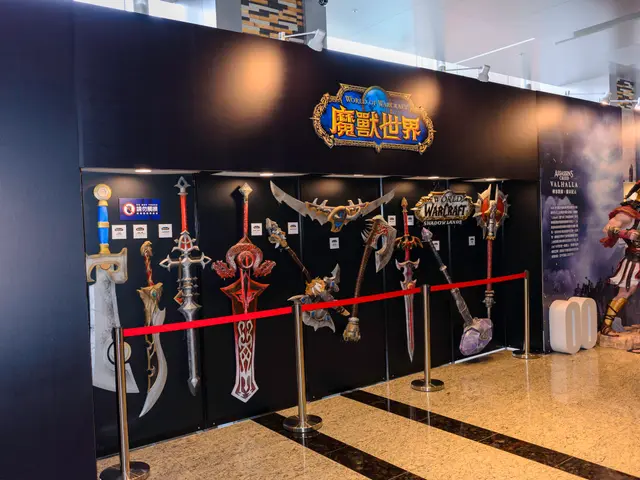 The image shows a display case filled with lots of different types of weapons, such as swords,...