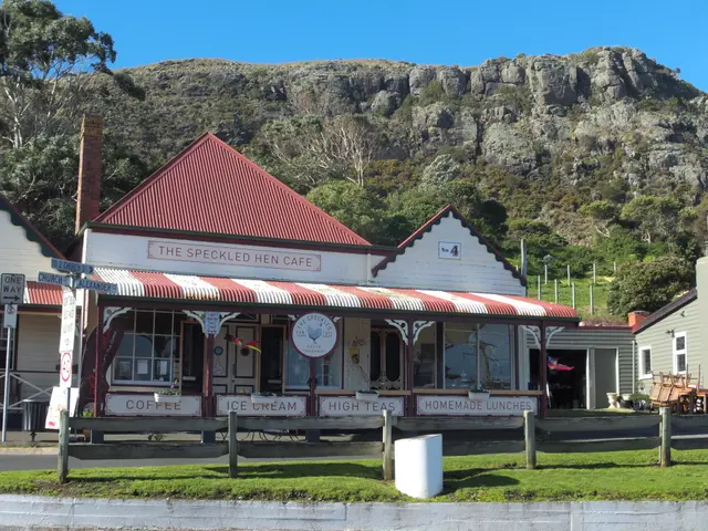 The image shows the Speckled Hen Cafe in Cape Town, South Africa. It is a building with windows and...
