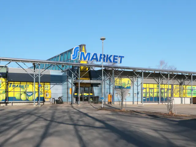The image shows a large building with a sign that says "Smart Market" on it, surrounded by street...