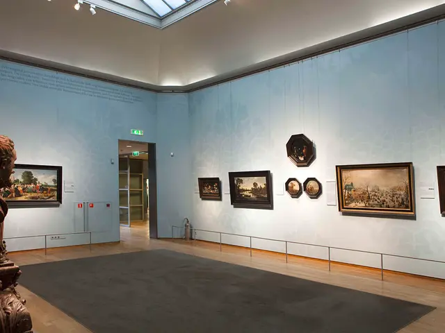 The image shows a large room with a statue on the left side, a carpet on the floor, photo frames on...