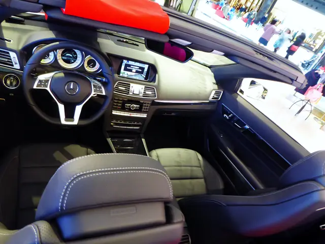 The image shows the interior of a Mercedes-Benz E-Class Cabriolet at the Frankfurt Motor Show....