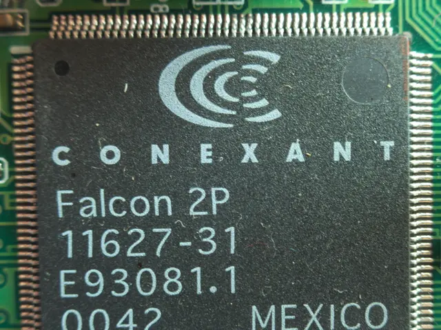 The image shows a close up of a chip on a circuit board with the text "Falcon 2P" printed on it....