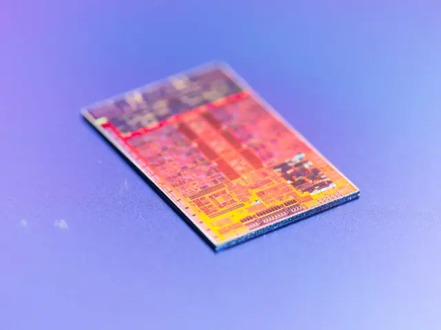The image shows a close up of a microchip on a blue surface, which is the new Intel processor.
