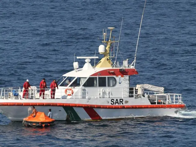 The image shows a white and red boat with people on it in the water, surrounded by an orange...