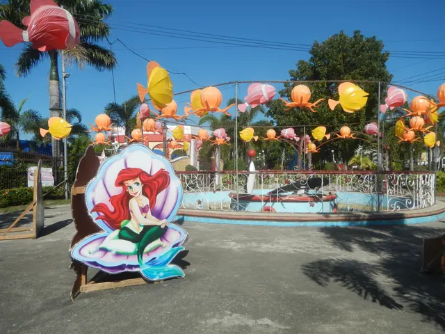 The image shows Ariel the Little Mermaid at Disney's Hollywood Studios, surrounded by a metal...