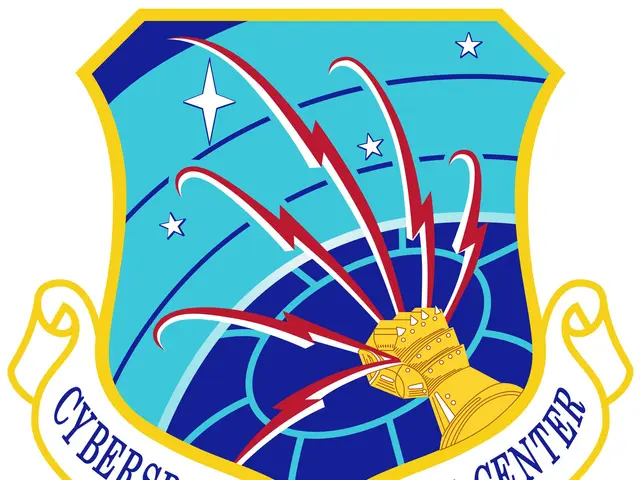The image shows the logo of the Cyberspace Capabilities Center, which consists of a blue shield...