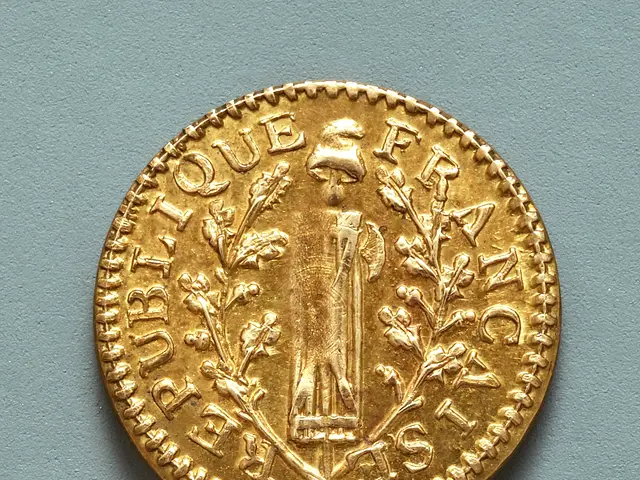 The image shows a gold coin with an image of a woman on it, resting on a surface. The coin is a...
