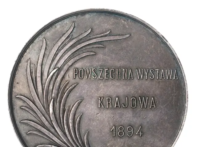 The image shows a silver coin with the words "Powszecchina Wystawa Krajowa" written on it against a...