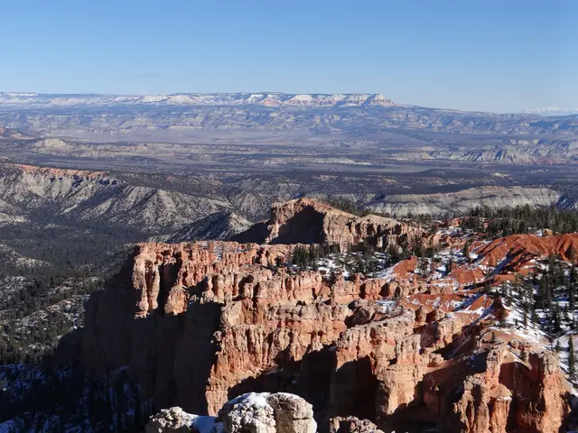 The image shows Bryce Canyon National Park in Utah, with its majestic mountains, lush trees, and...