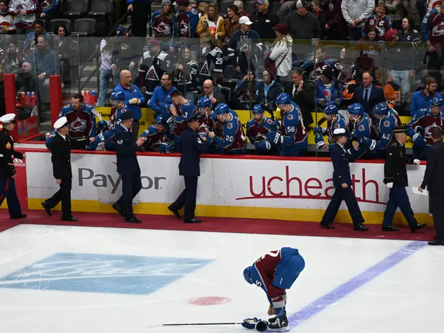 The image shows a hockey player on the ice with a stick in his hand, surrounded by a group of...