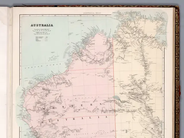 The image shows an open book with a map of Australia on it. The map is detailed and shows the...