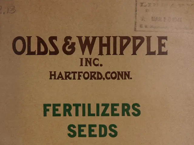 The image shows an old book with a picture of a plant on the cover page and text that reads...