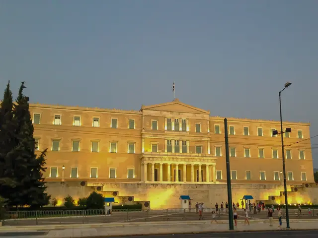 The image shows the Greek Parliament building in Athens, Greece. It is a large building with...