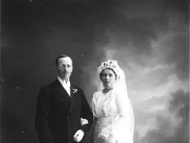 The image shows an old black and white photo of a man and woman on their wedding day. The man is...