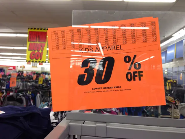The image shows a store with a sign that reads "Kids Apparel 30% Off" in the foreground. In the...