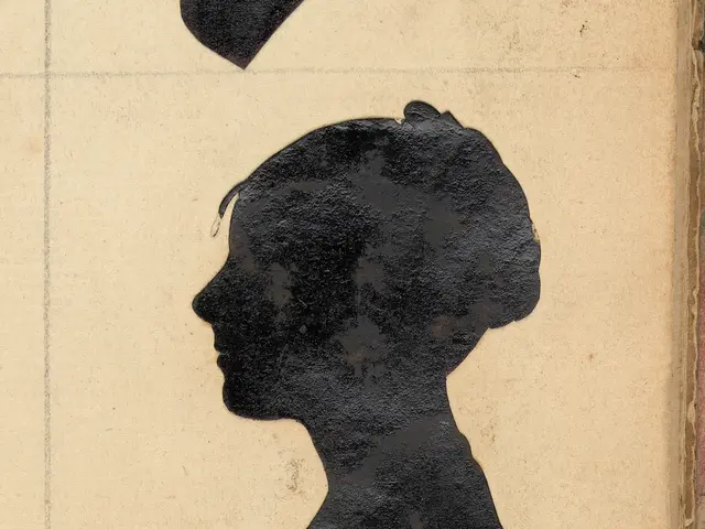 The image shows an old book with a black silhouette of a woman's face on the cover. The woman's...