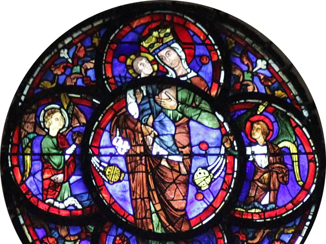 The image shows a stained-glass window in a church depicting a woman holding a child. The window is...