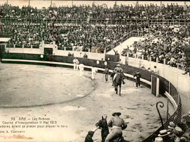 The image shows an old black and white photo of a bullfight in a stadium, with a group of people...