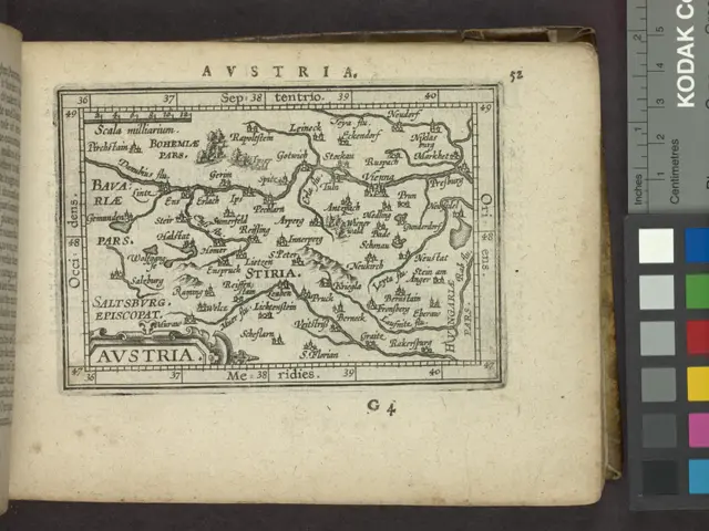 The image shows an open book with a map of Austria on it. The map is detailed and shows various...