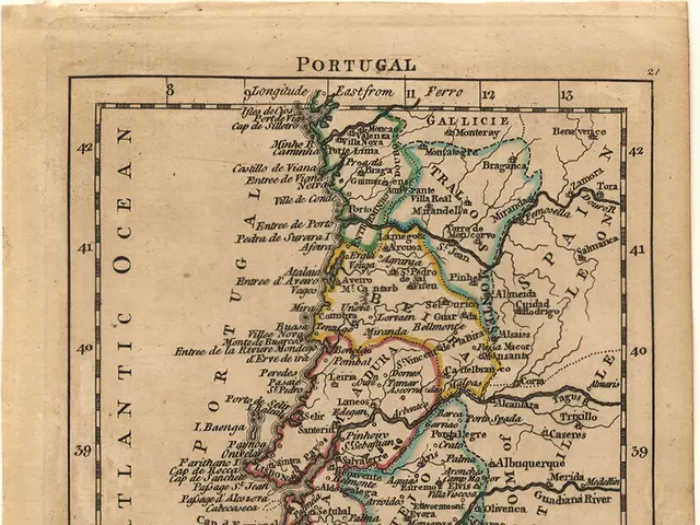 The image shows an old map of Portugal with the provinces of Portugal and the Atlantic Ocean...