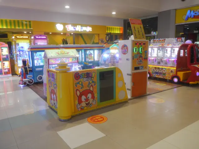 The image shows a large room filled with lots of different types of arcade machines, with a floor...