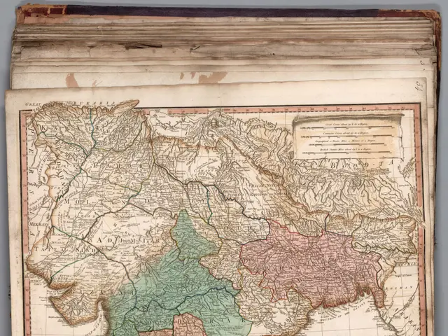 The image shows an old book with a map of India on it. The map is detailed and shows the various...