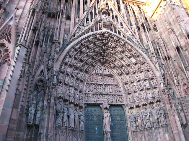 The image shows the entrance to Cologne Cathedral in Cologne, Germany. It is a large building with...
