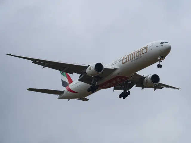 The image shows an Emirates Airbus A330-300 in flight, with its white, red and green livery...