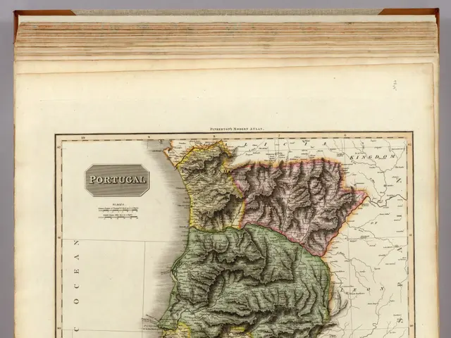 The image shows an old book with a map of Portugal on it. The map is detailed and shows the various...