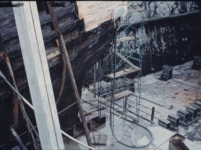 The image shows an old photo of a boat being built in a shipyard, with wooden planks, metal rods,...